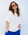 PrimeStyleAI fashion creator wearing orange sunglasses